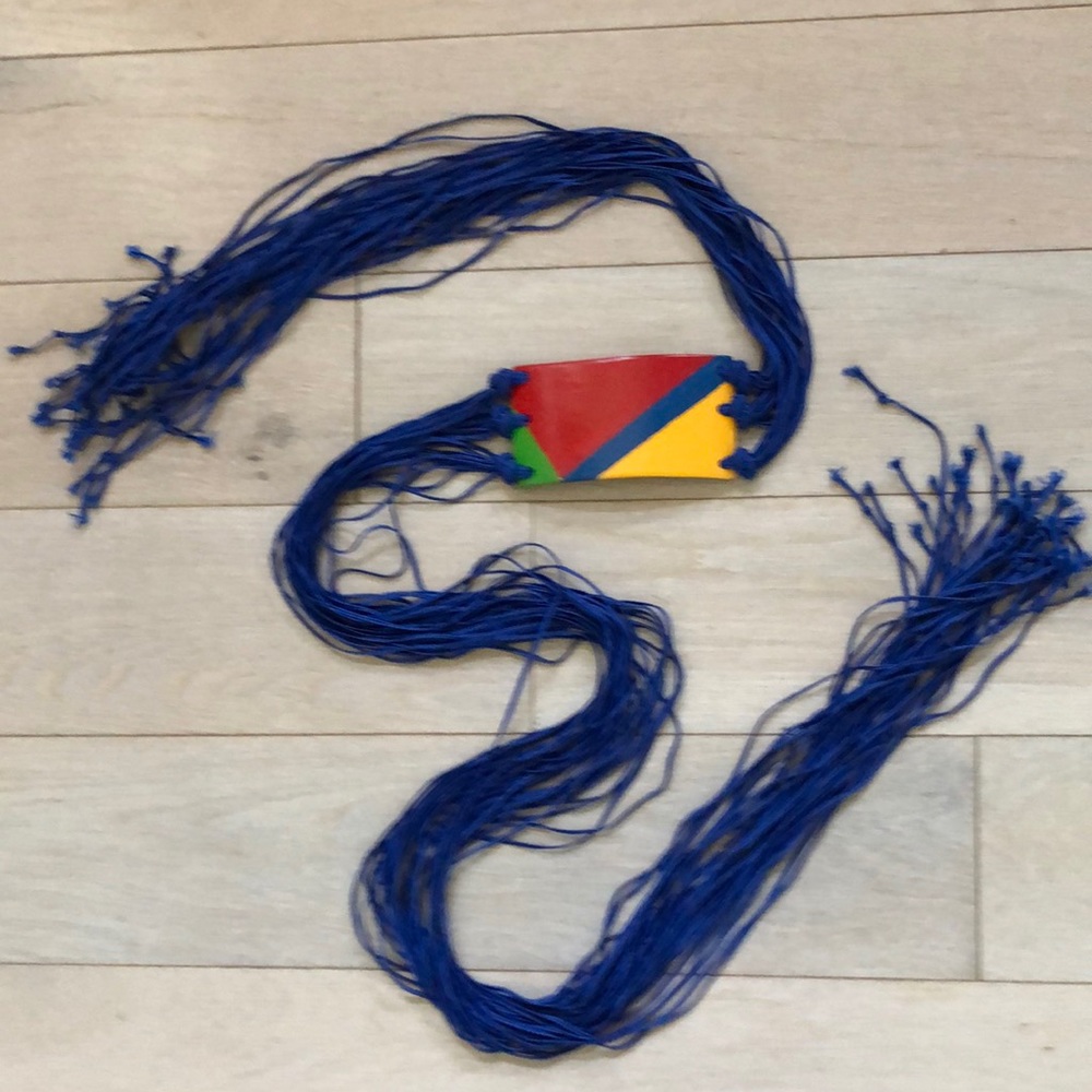 Blue cord wrap belt with multi color ceramic front; multi tie ends.